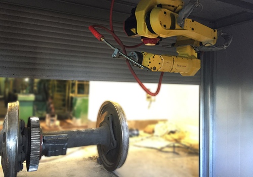 Vagonų ratų porų plovimo robotas